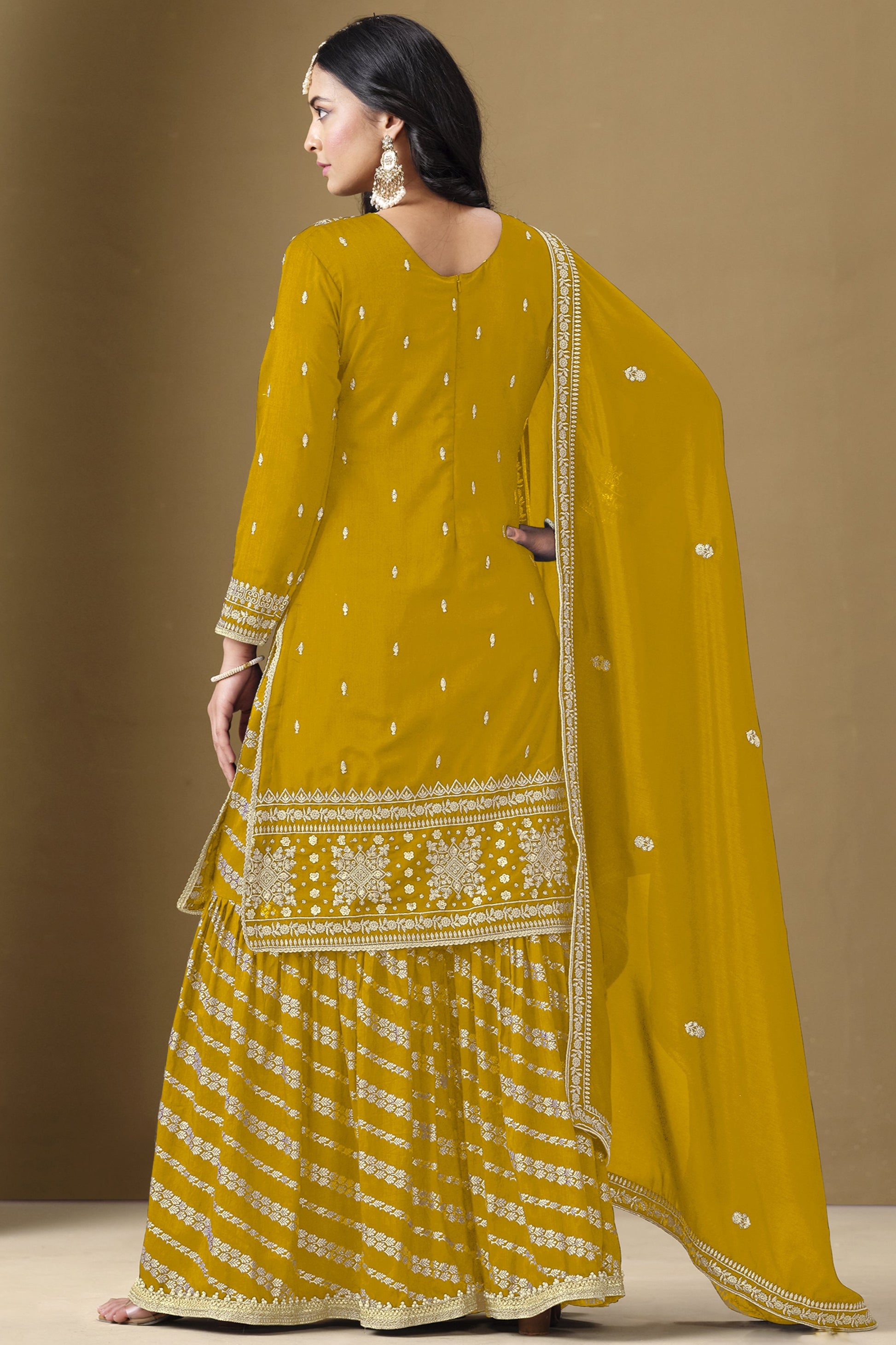 Yellow salwar kameez is bright and happy. Good for haldi or sunny events.
