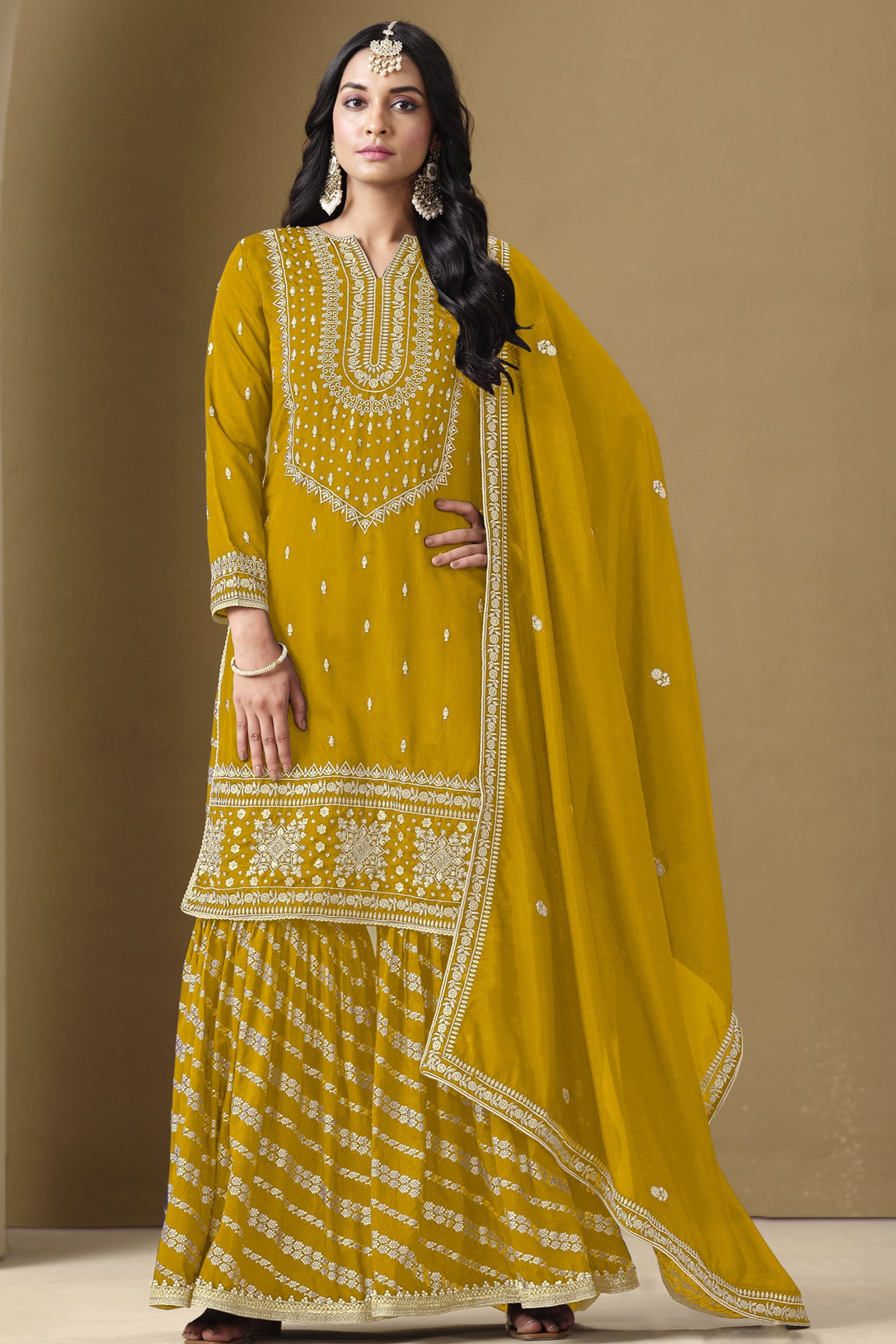Yellow salwar kameez is bright and happy. Good for haldi or sunny events.
