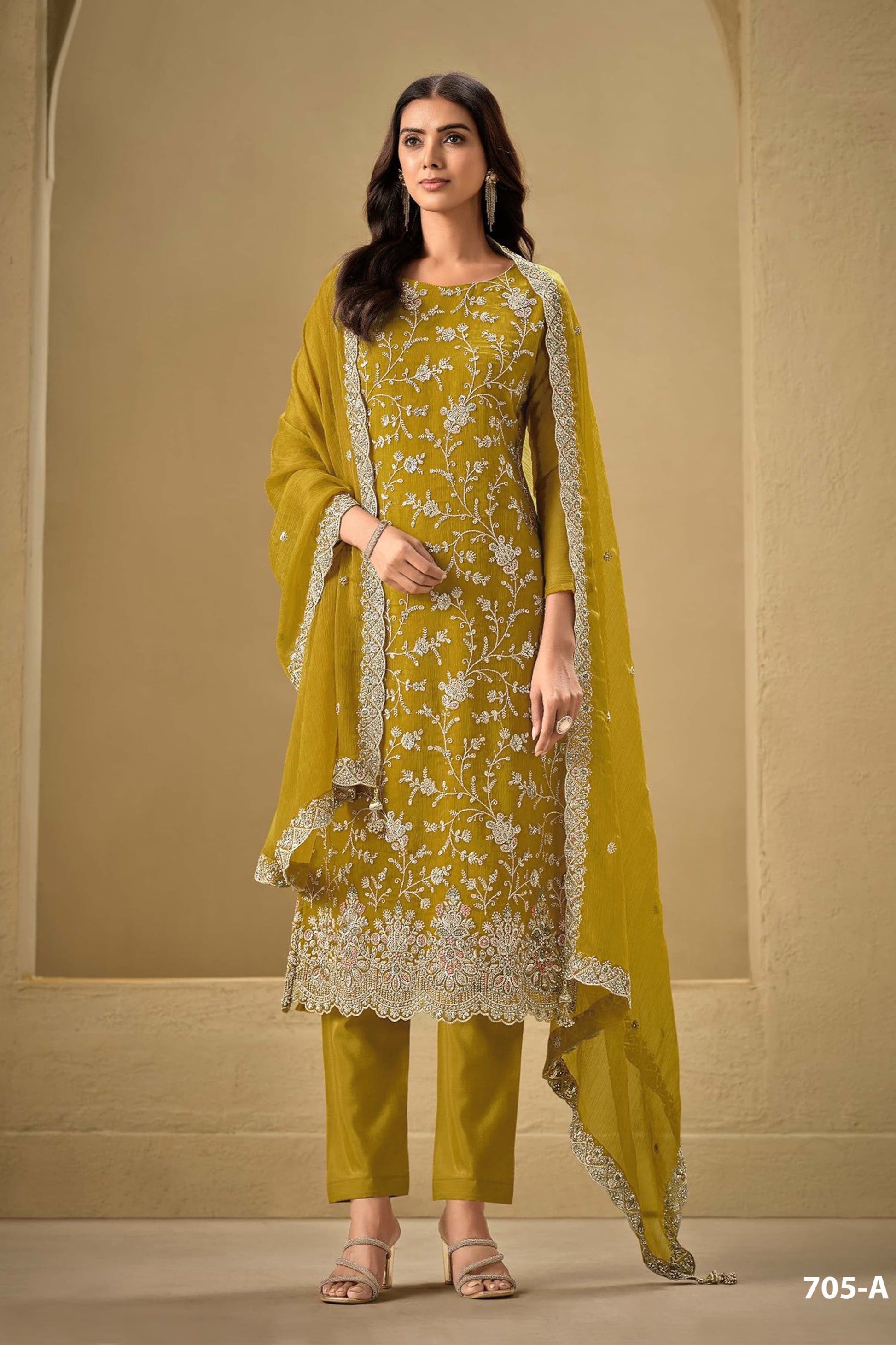 Gold salwar kameez looks royal and festive. Great for parties and celebrations.
