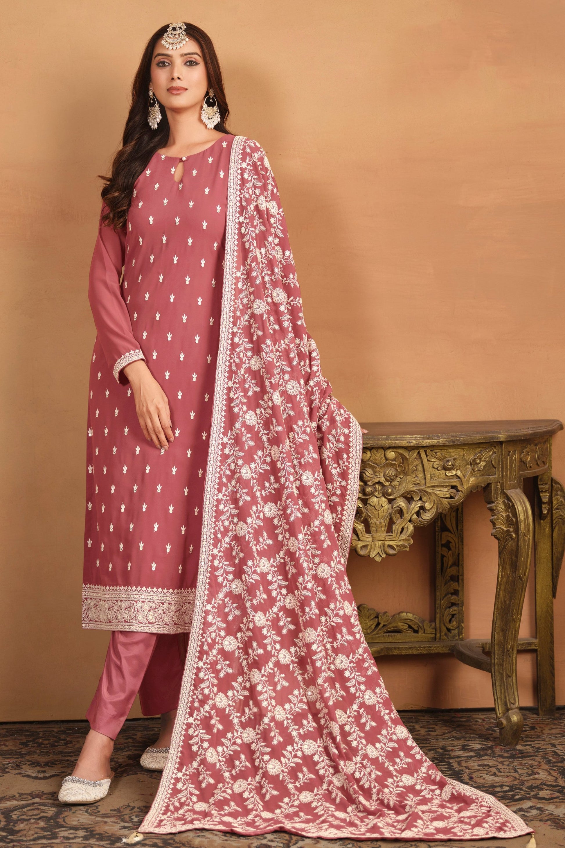 Peach salwar kameez brings soft elegance and warmth, perfect for daytime celebrations and festive charm.