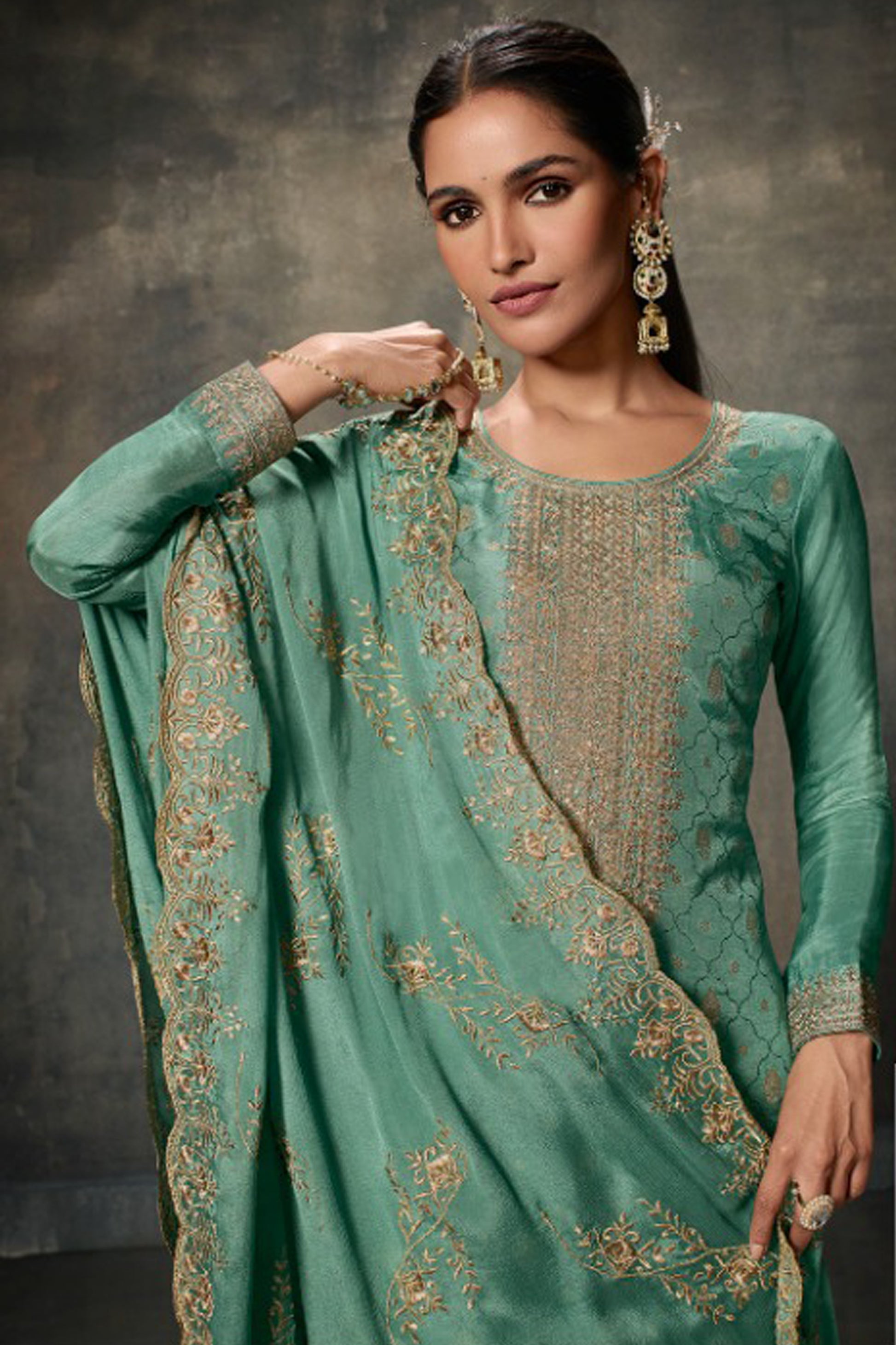 Teal salwar kameez is cool and refreshing. It blends blue and green for a unique look