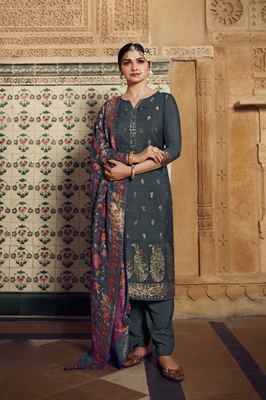 Grey salwar kameez looks simple and stylish. Metallic accents make it modern.
