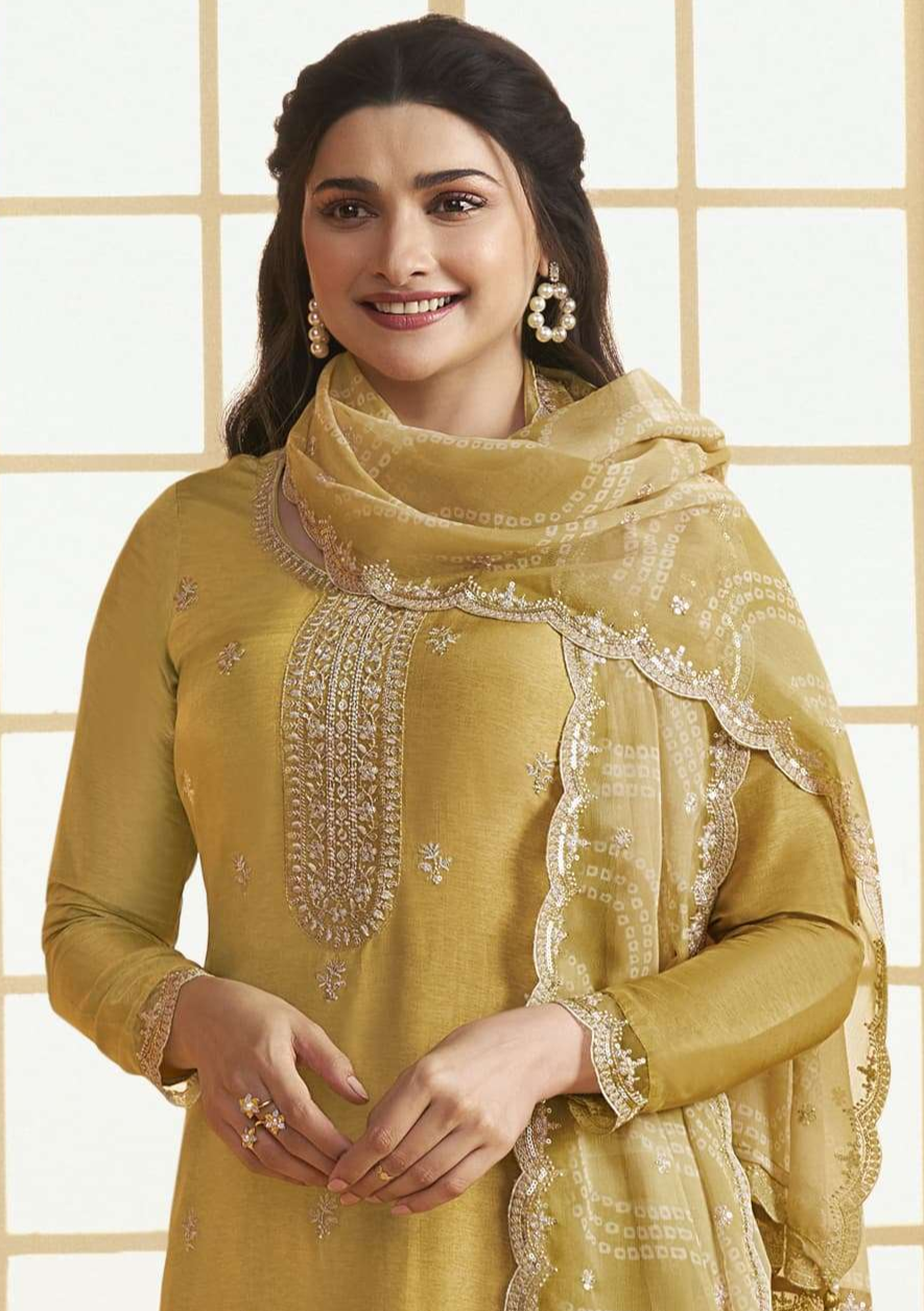 Yellow salwar kameez is bright and happy. Good for haldi or sunny events.
