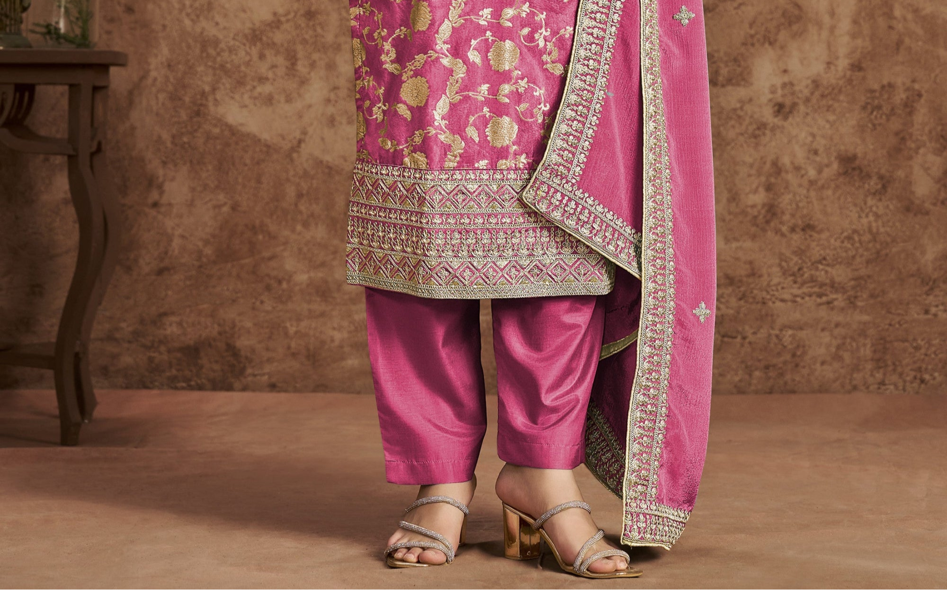 Pink salwar kameez is cheerful and lovely. Perfect for celebrations.
