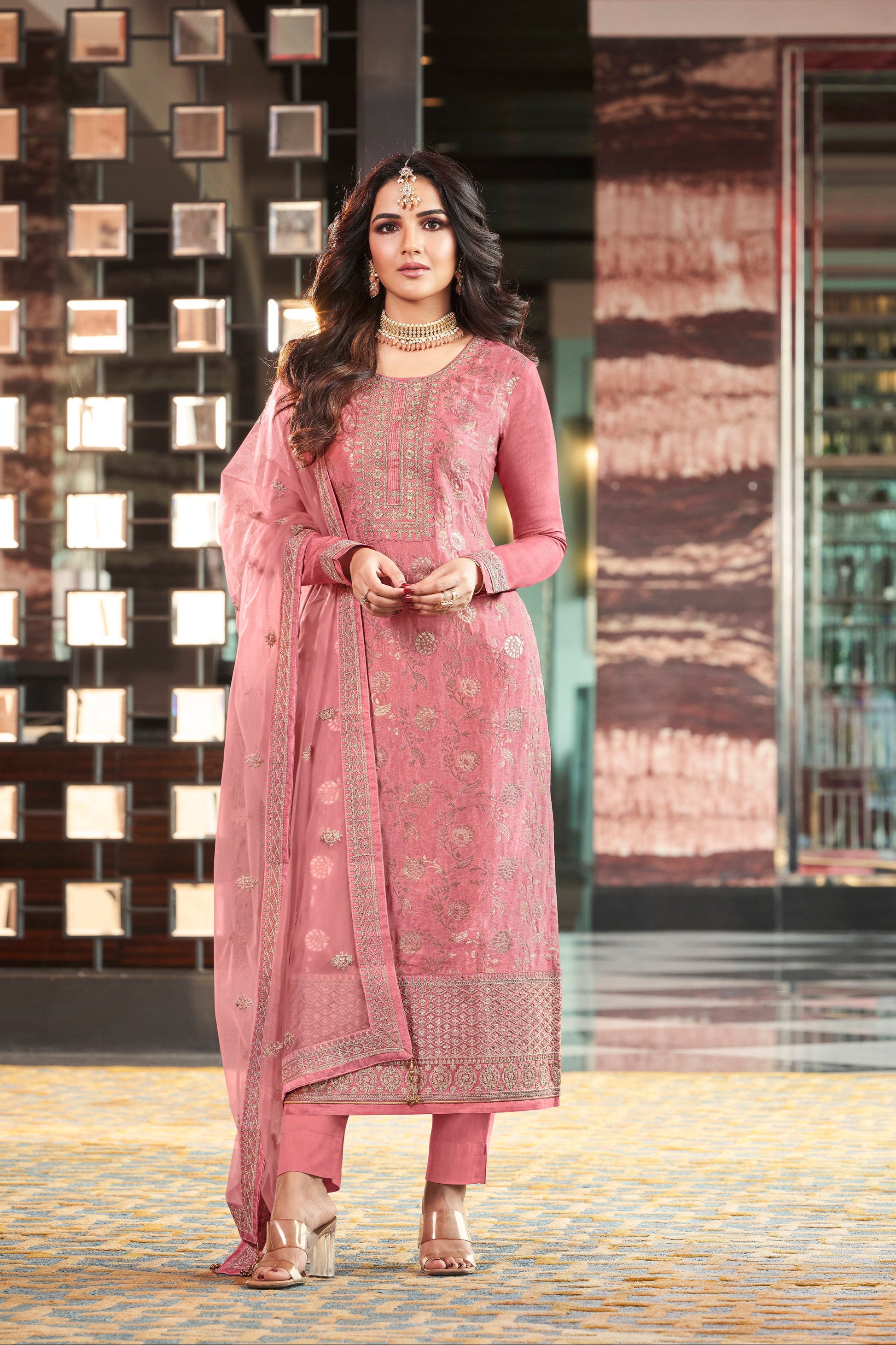 Pink salwar kameez is cheerful and lovely. Perfect for celebrations.
