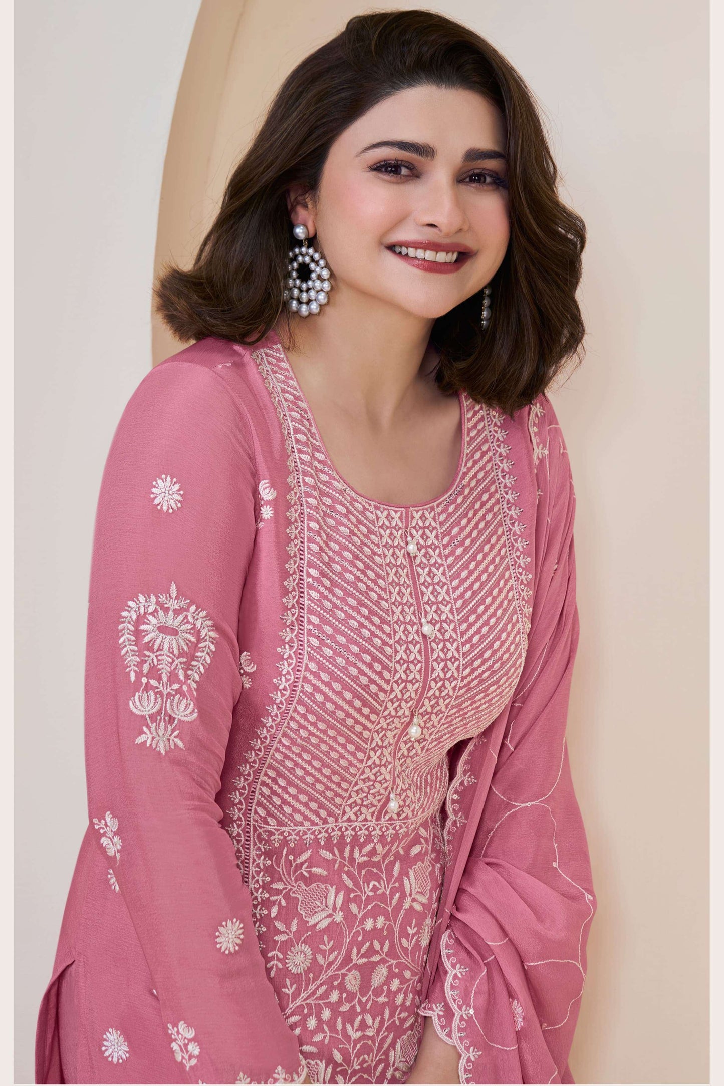 Pink salwar kameez is cheerful and lovely. Perfect for celebrations.
