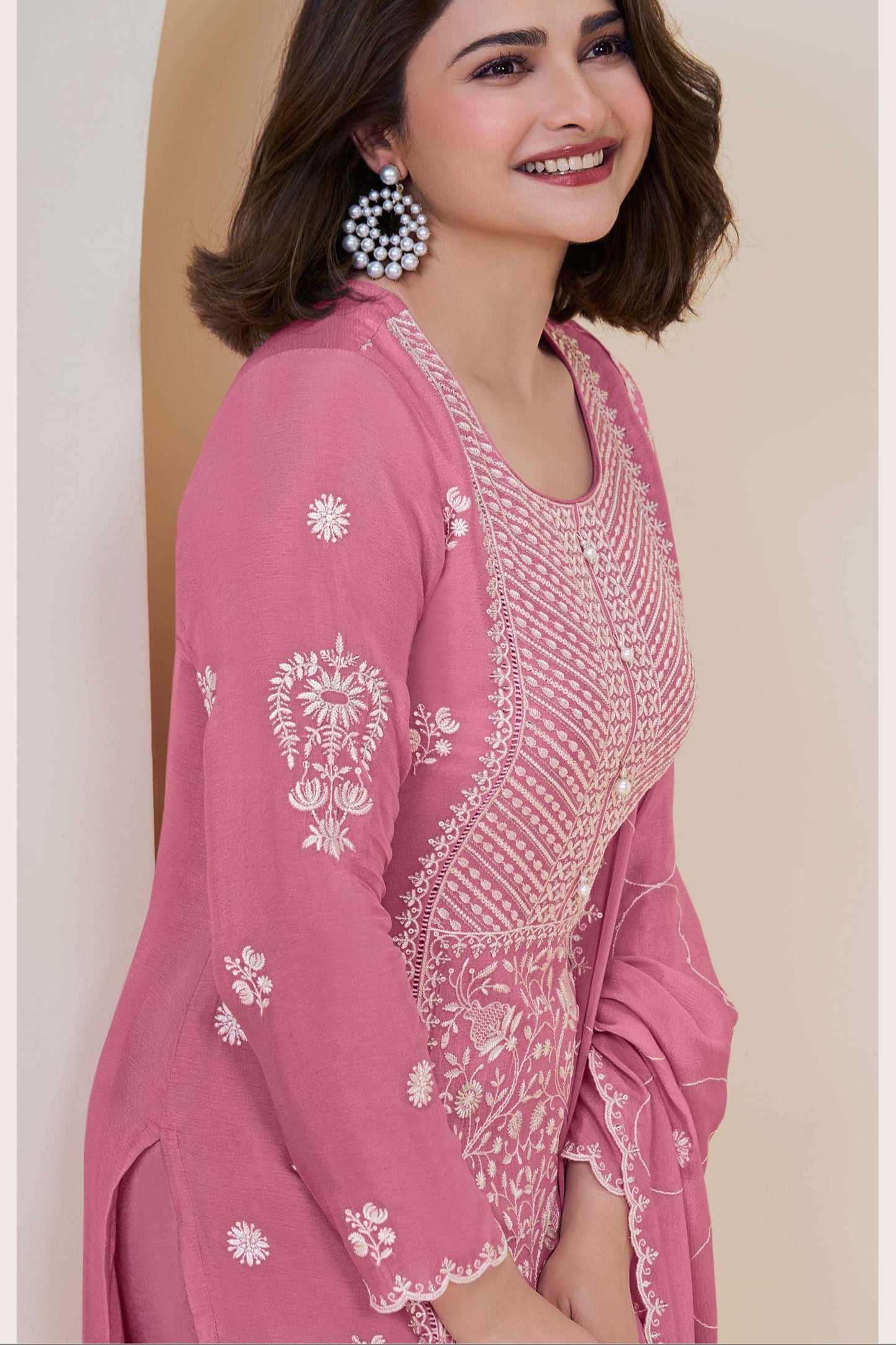 Pink salwar kameez is cheerful and lovely. Perfect for celebrations.
