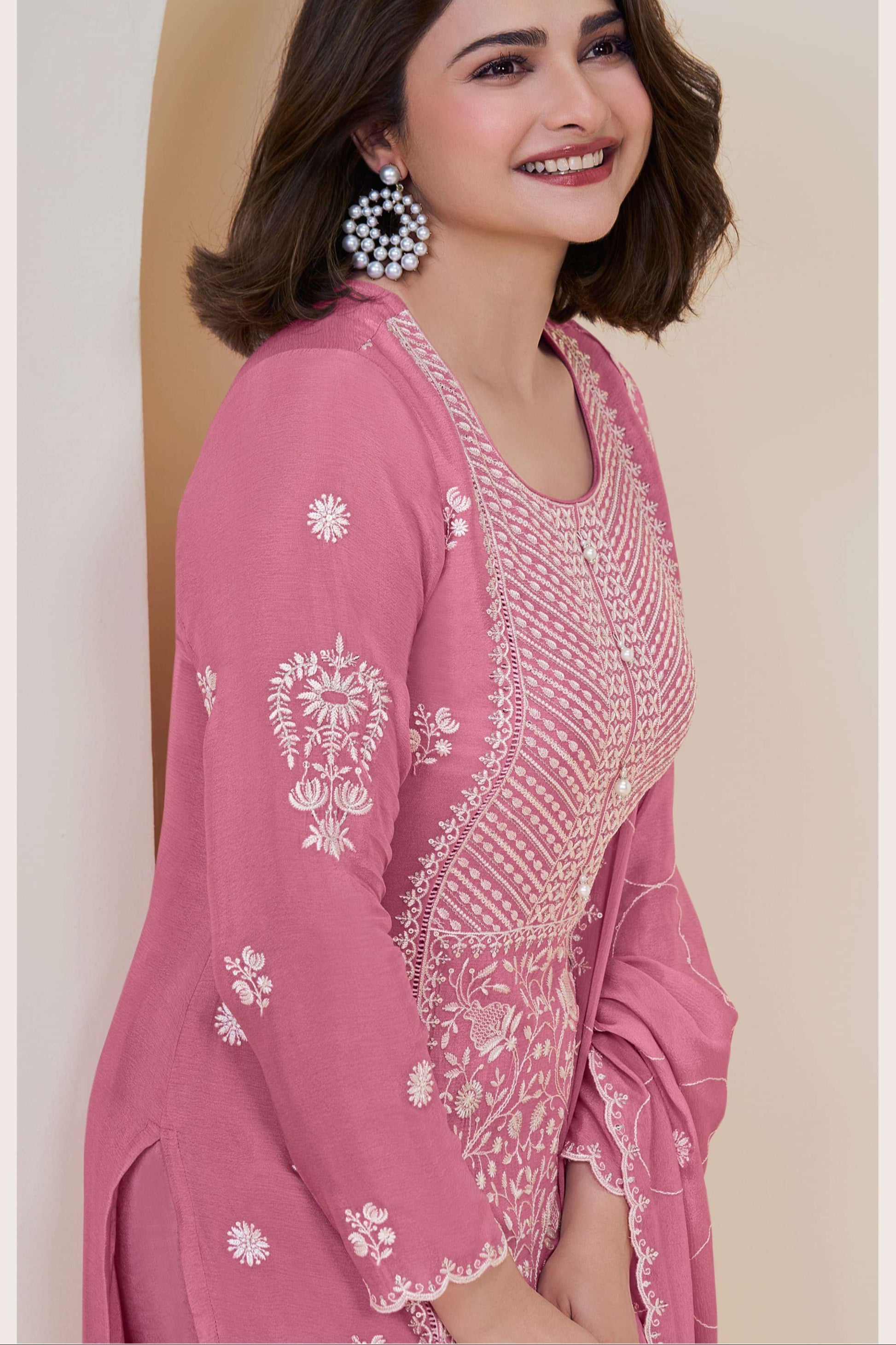Pink salwar kameez is cheerful and lovely. Perfect for celebrations.
