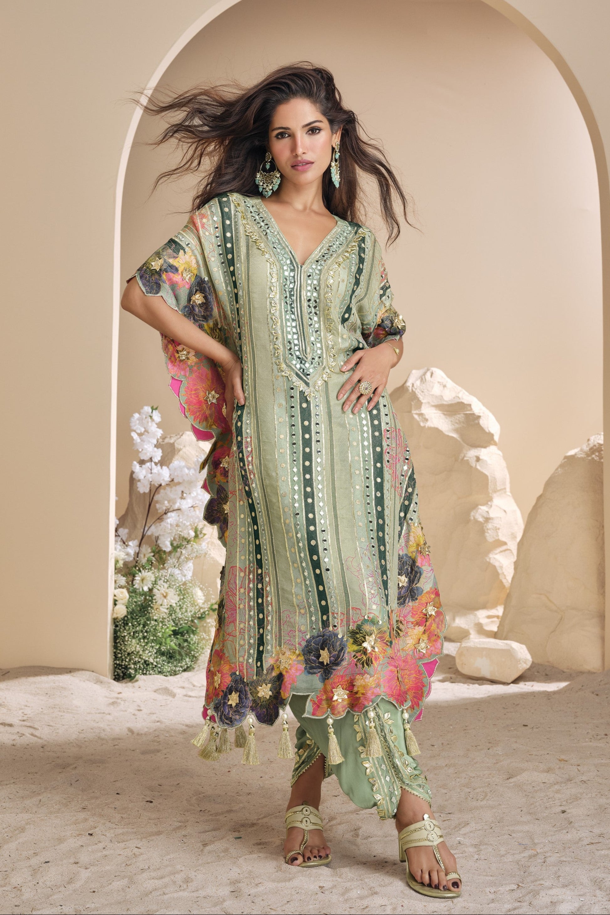 Light green color salwar kameez in viscose silk with embroidery, mirror work, and embellished detailing, bringing a fresh and graceful charm to festive occasions.
