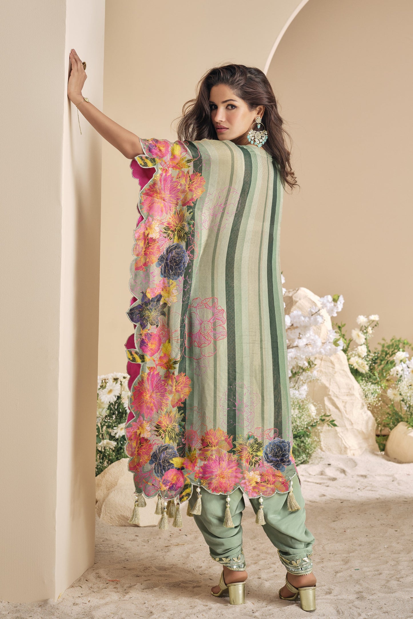 Light green color salwar kameez in viscose silk with embroidery, mirror work, and embellished detailing, bringing a fresh and graceful charm to festive occasions.
