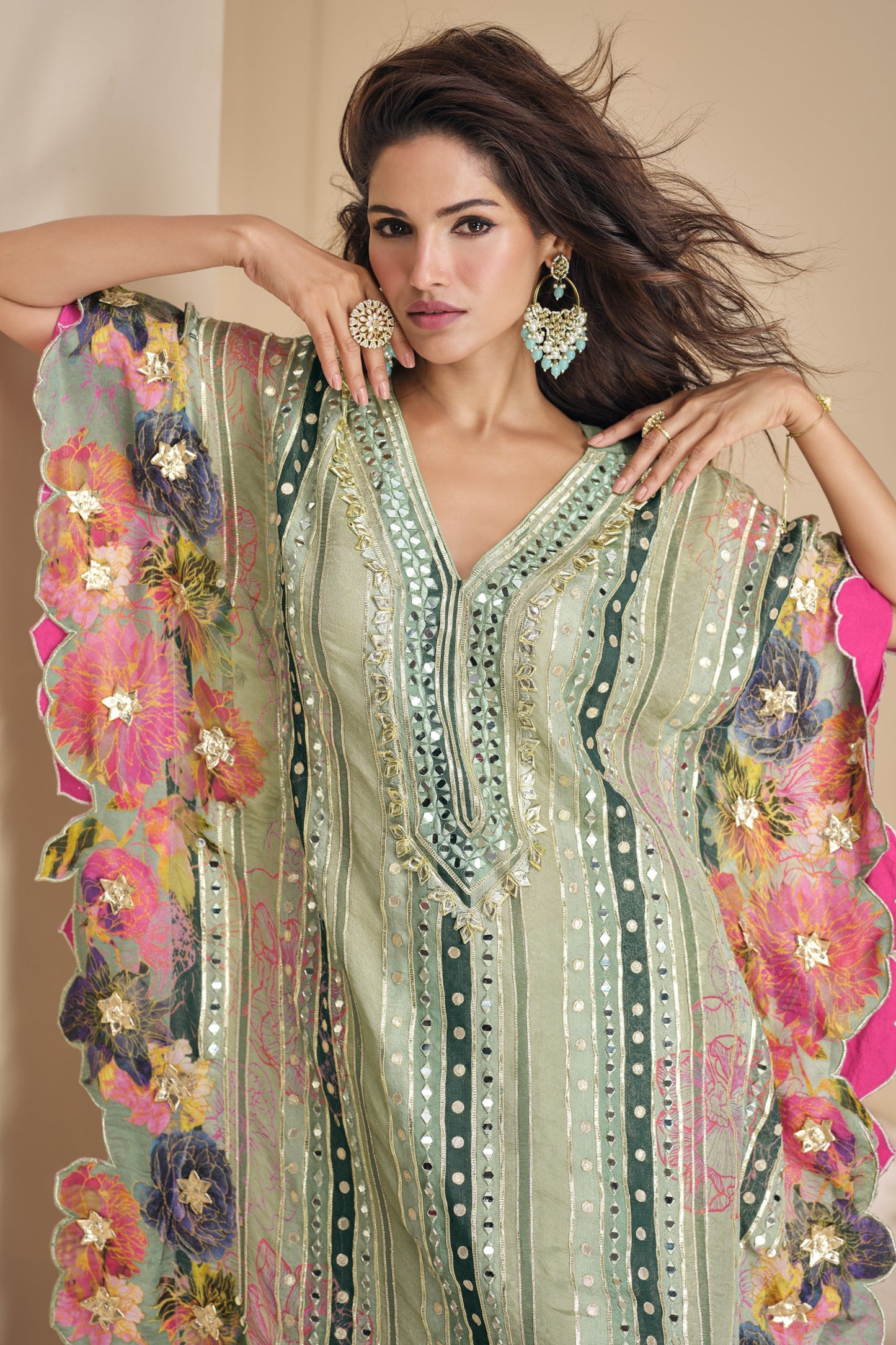 Light green color salwar kameez in viscose silk with embroidery, mirror work, and embellished detailing, bringing a fresh and graceful charm to festive occasions.
