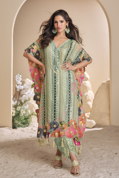 Light green color salwar kameez in viscose silk with embroidery, mirror work, and embellished detailing, bringing a fresh and graceful charm to festive occasions.
