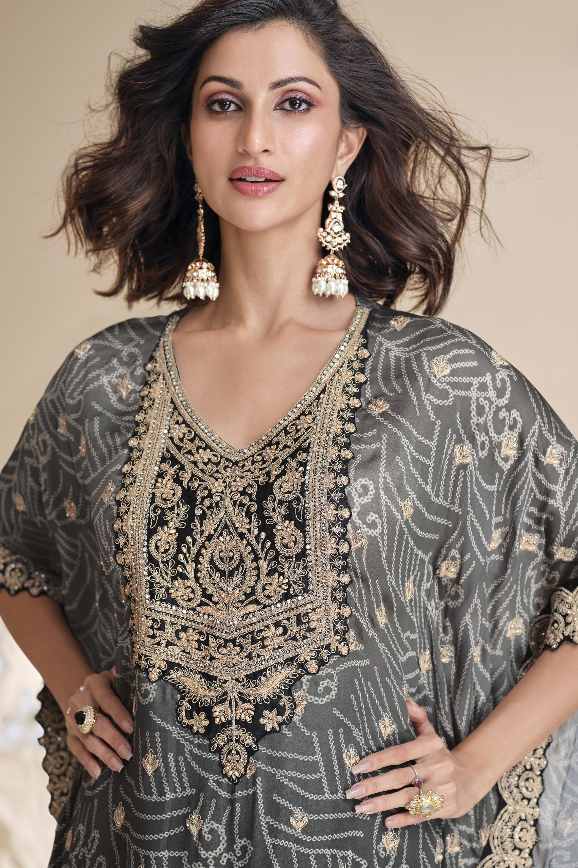 Black color salwar kameez in viscose silk with embroidery, mirror work, and embellished detailing, offering a bold and elegant look for festive and special events.
