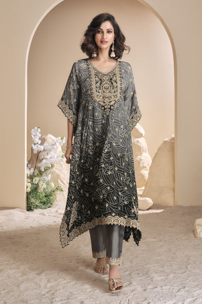Black color salwar kameez in viscose silk with embroidery, mirror work, and embellished detailing, offering a bold and elegant look for festive and special events.
