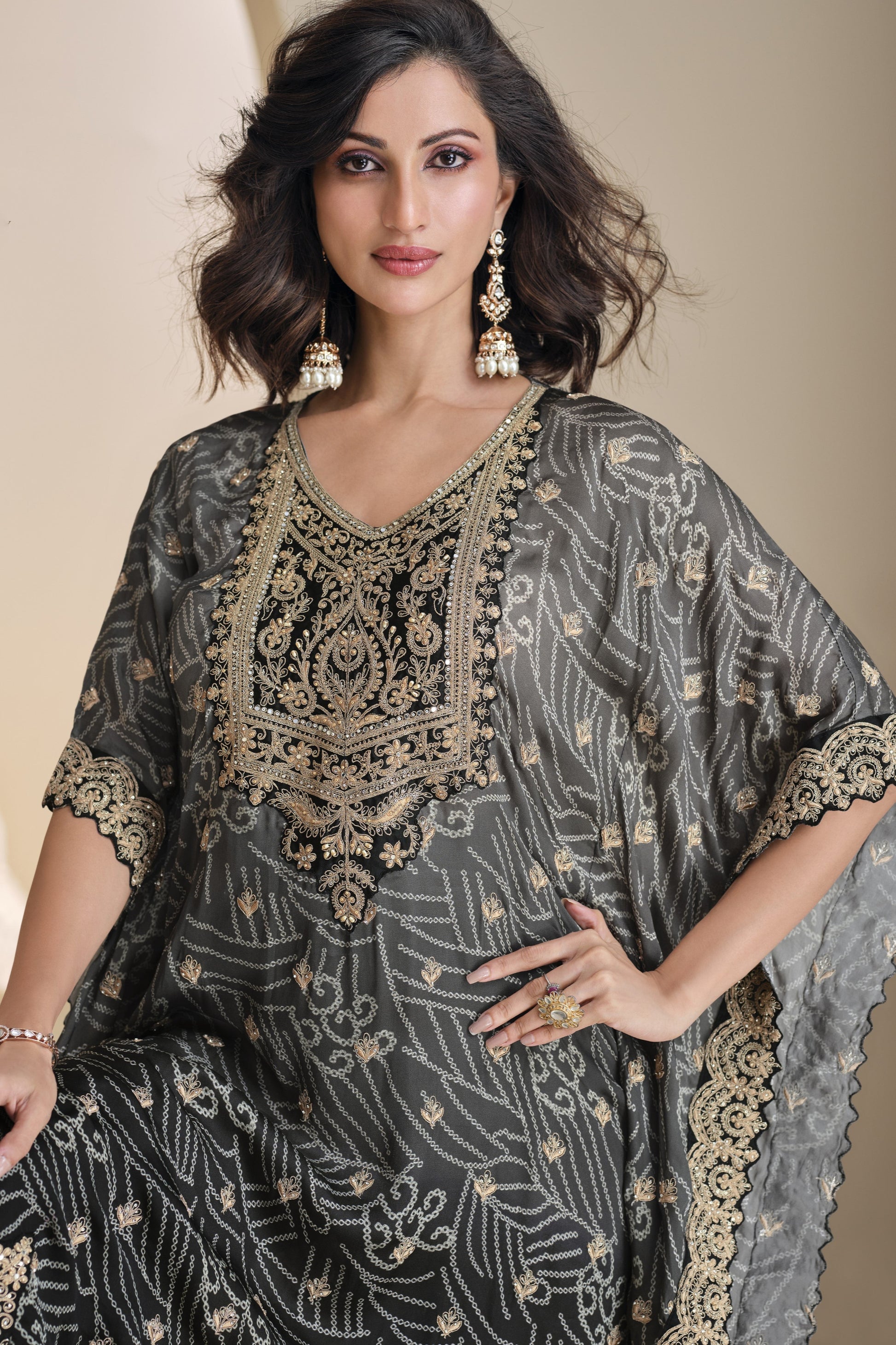 Black color salwar kameez in viscose silk with embroidery, mirror work, and embellished detailing, offering a bold and elegant look for festive and special events.
