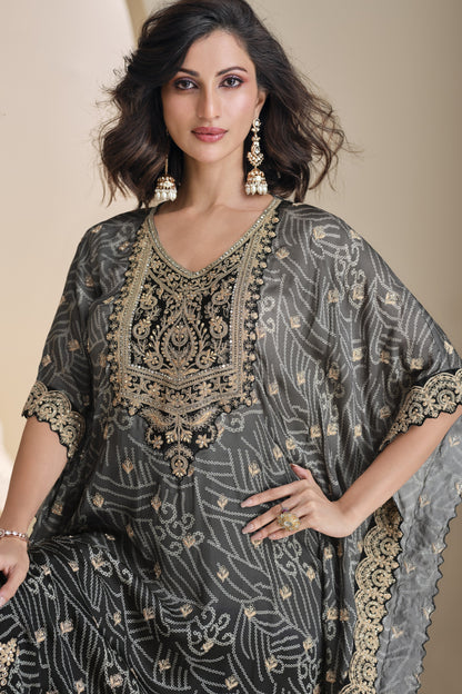 Black color salwar kameez in viscose silk with embroidery, mirror work, and embellished detailing, offering a bold and elegant look for festive and special events.
