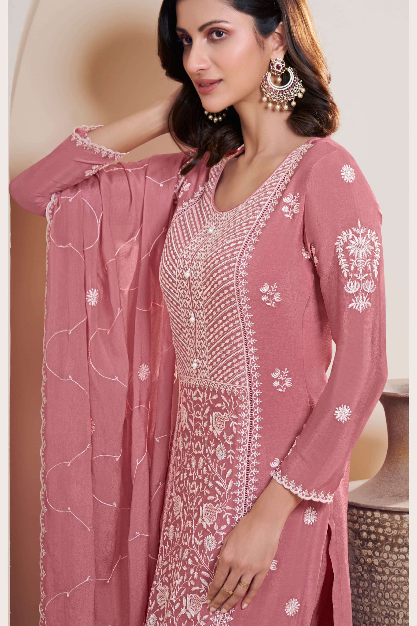 Pink salwar kameez is cheerful and lovely. Perfect for celebrations.

