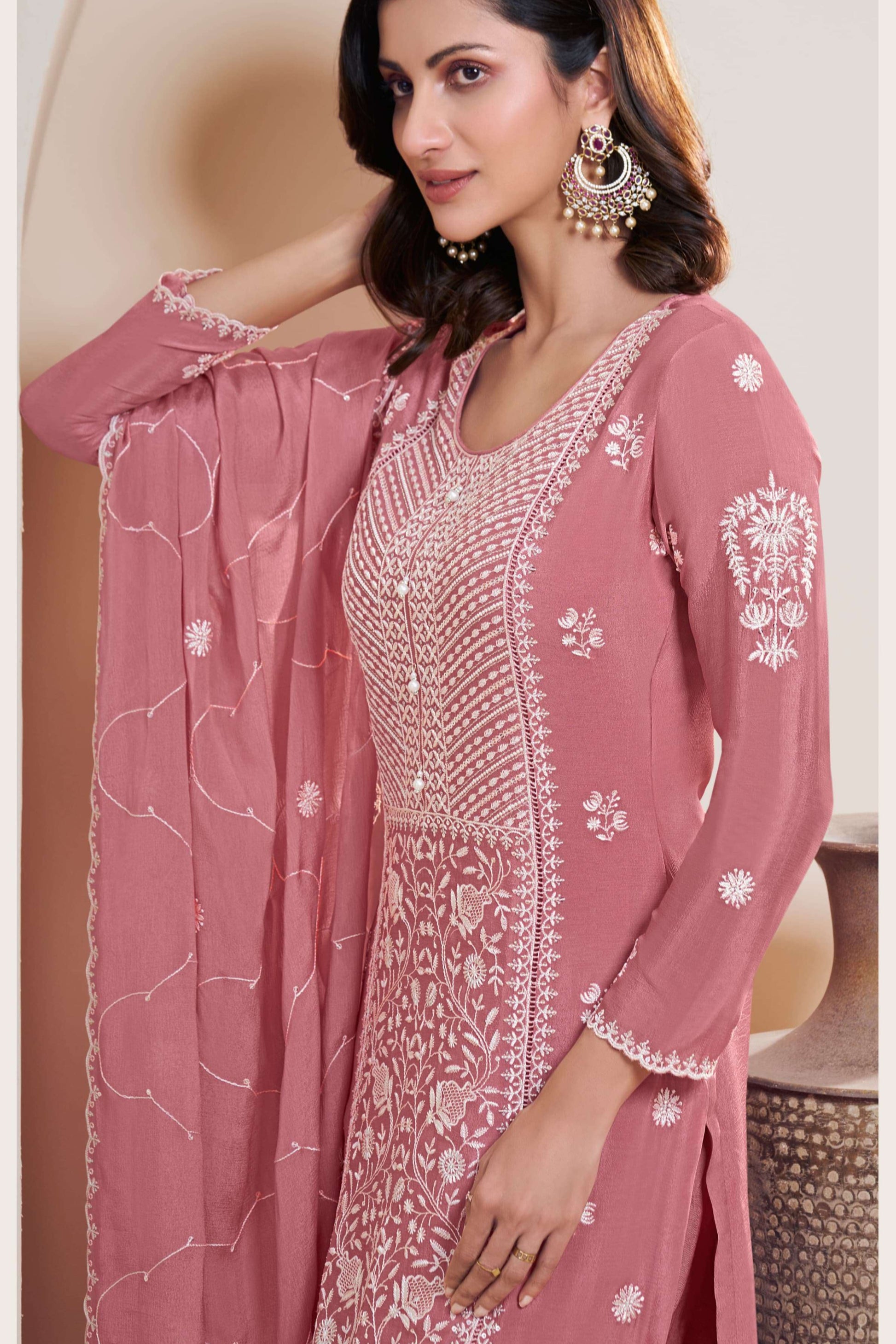 Pink salwar kameez is cheerful and lovely. Perfect for celebrations.
