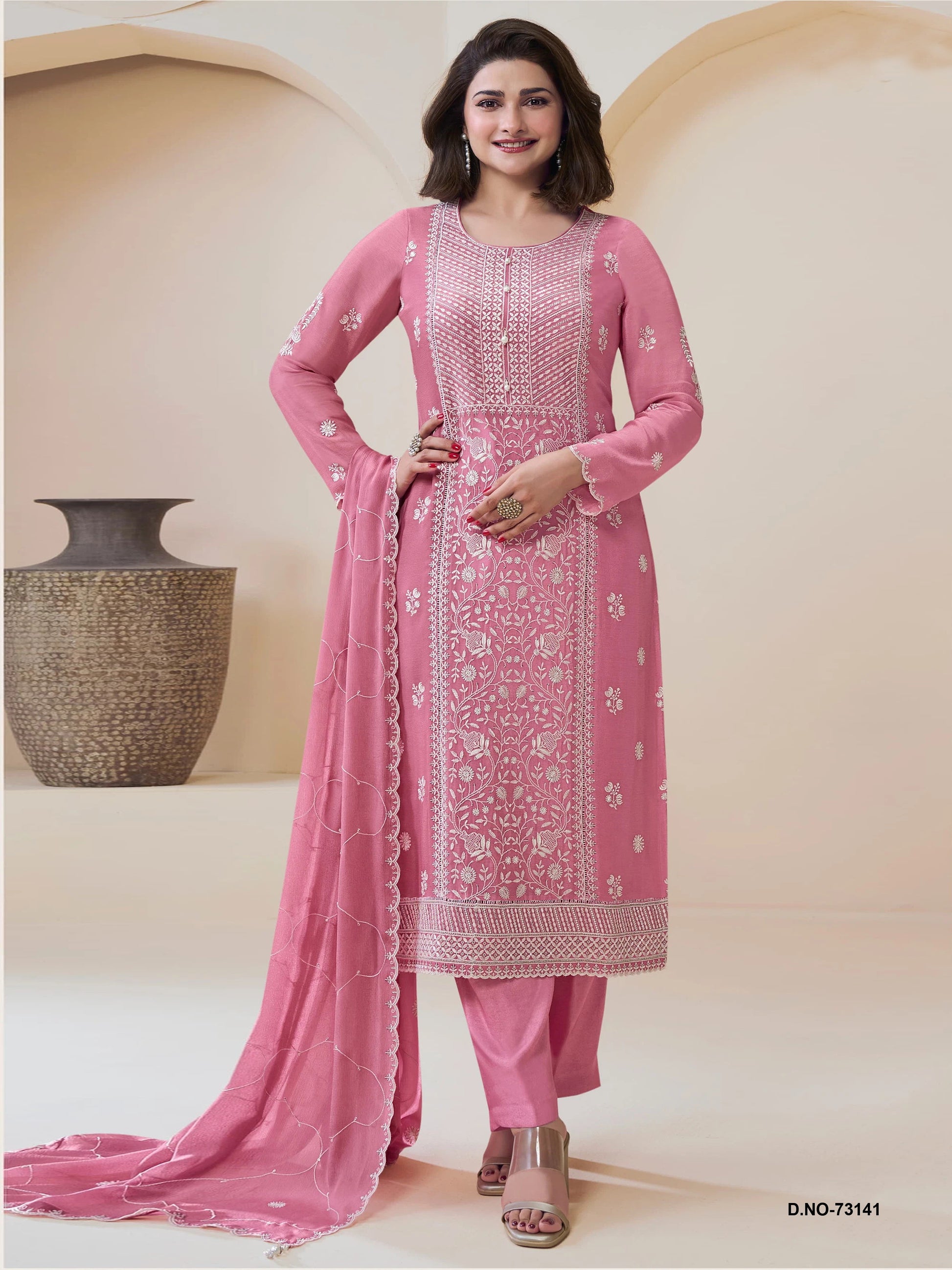 Pink salwar kameez is cheerful and lovely. Perfect for celebrations.
