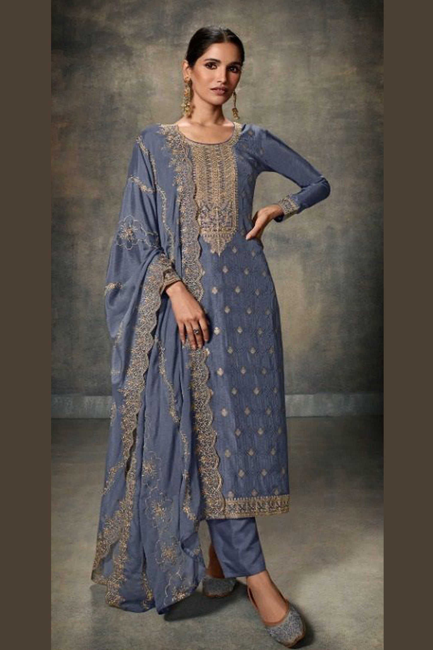 Grey salwar kameez looks simple and stylish. Metallic accents make it modern.
