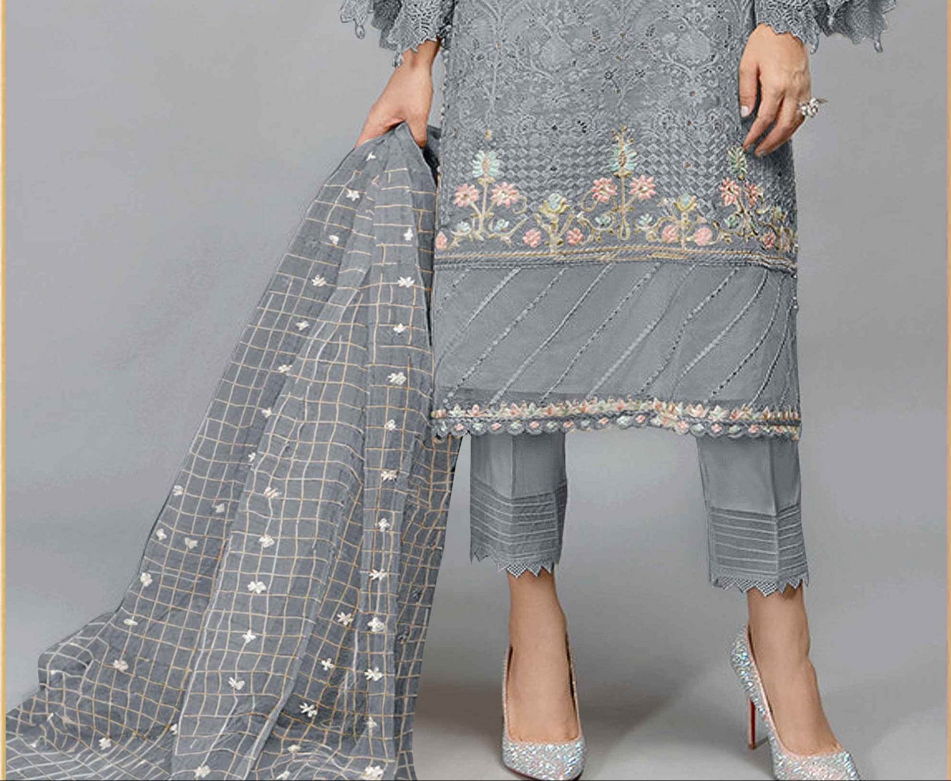 Grey salwar kameez looks simple and stylish. Metallic accents make it modern.
