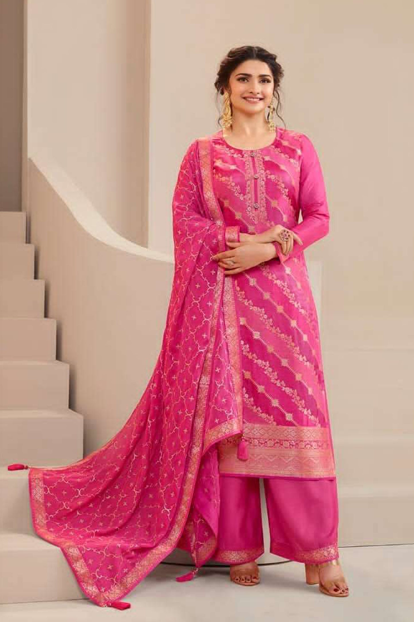 Pink salwar kameez is cheerful and lovely. Perfect for celebrations.
