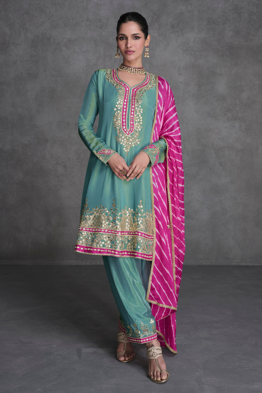 Teal salwar kameez is cool and refreshing. It blends blue and green for a unique look