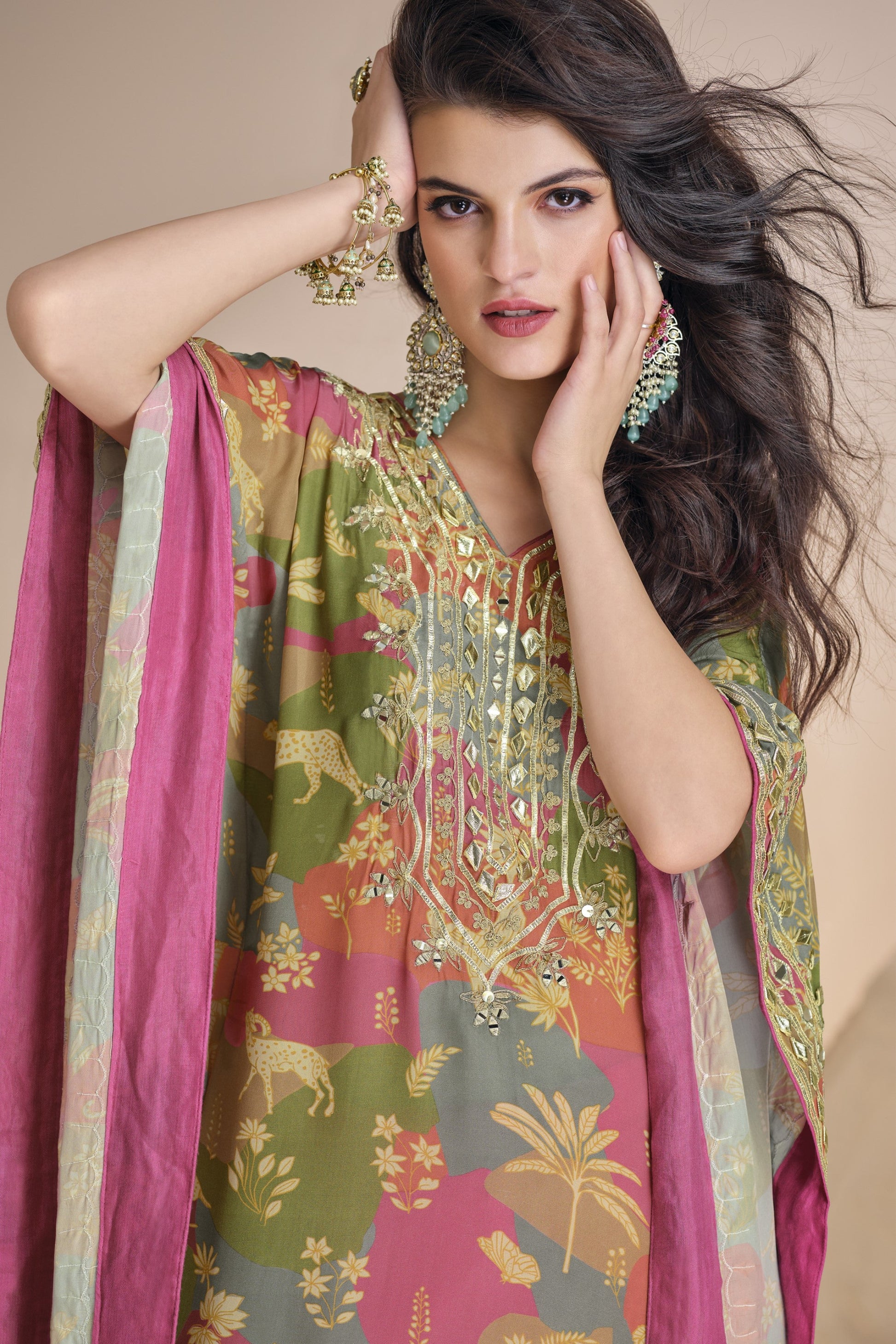 Pink color salwar kameez in viscose silk featuring embroidery, mirror work, and embellished detailing, perfect for festive and party wear occasions.
