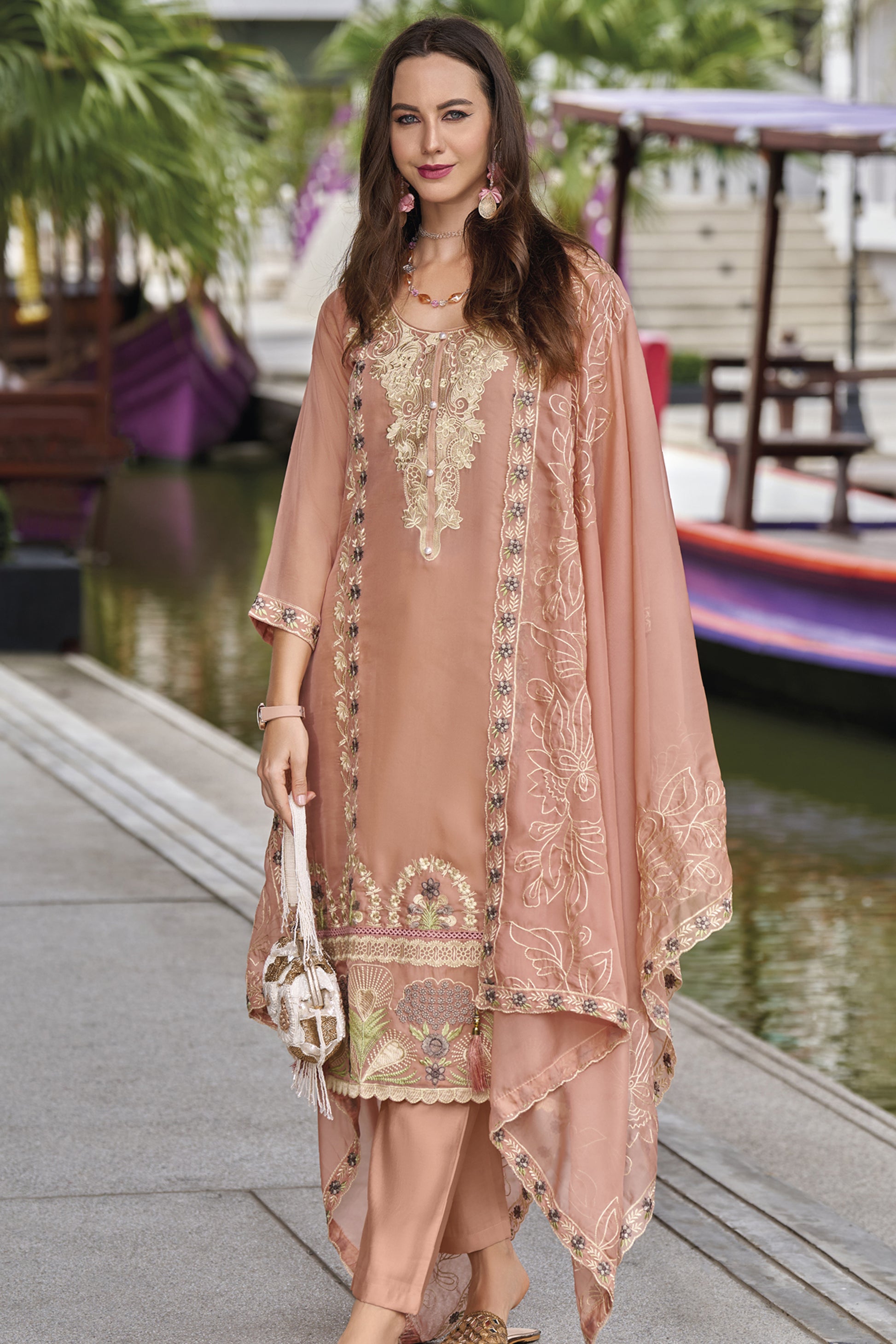 Pink salwar kameez is cheerful and lovely. Perfect for celebrations.
