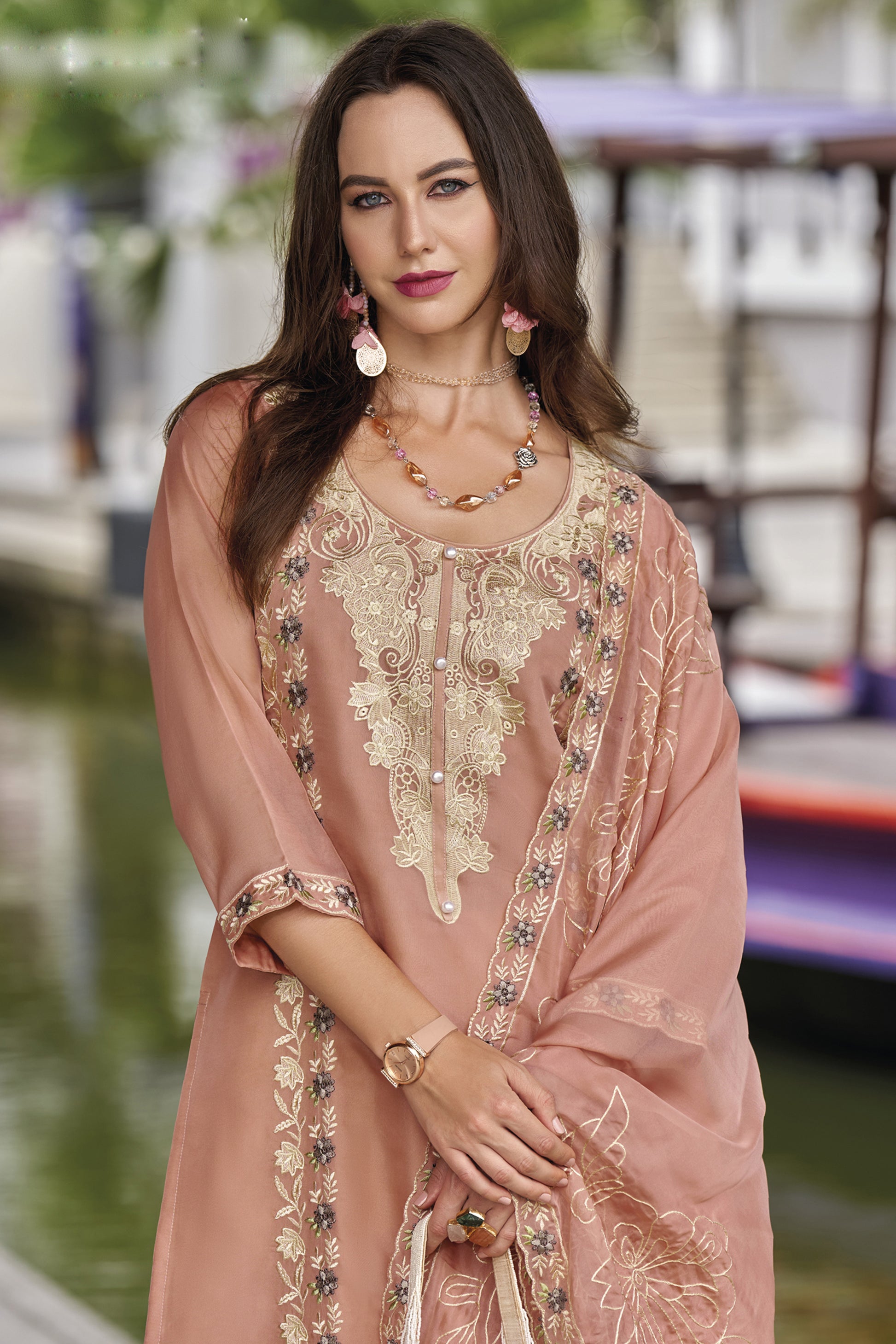 Pink salwar kameez is cheerful and lovely. Perfect for celebrations.
