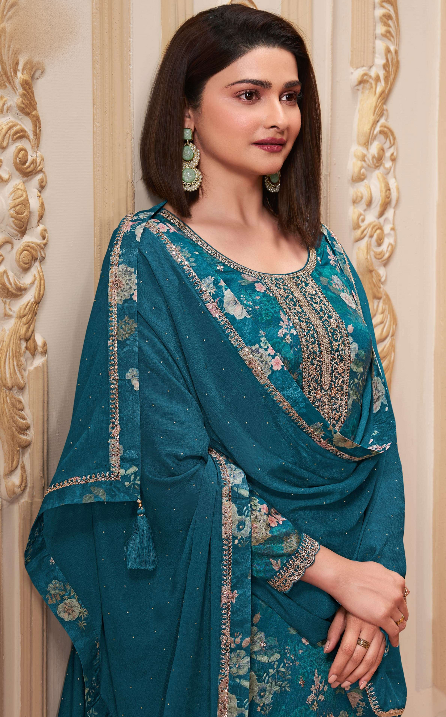 Teal salwar kameez is cool and refreshing. It blends blue and green for a unique look
