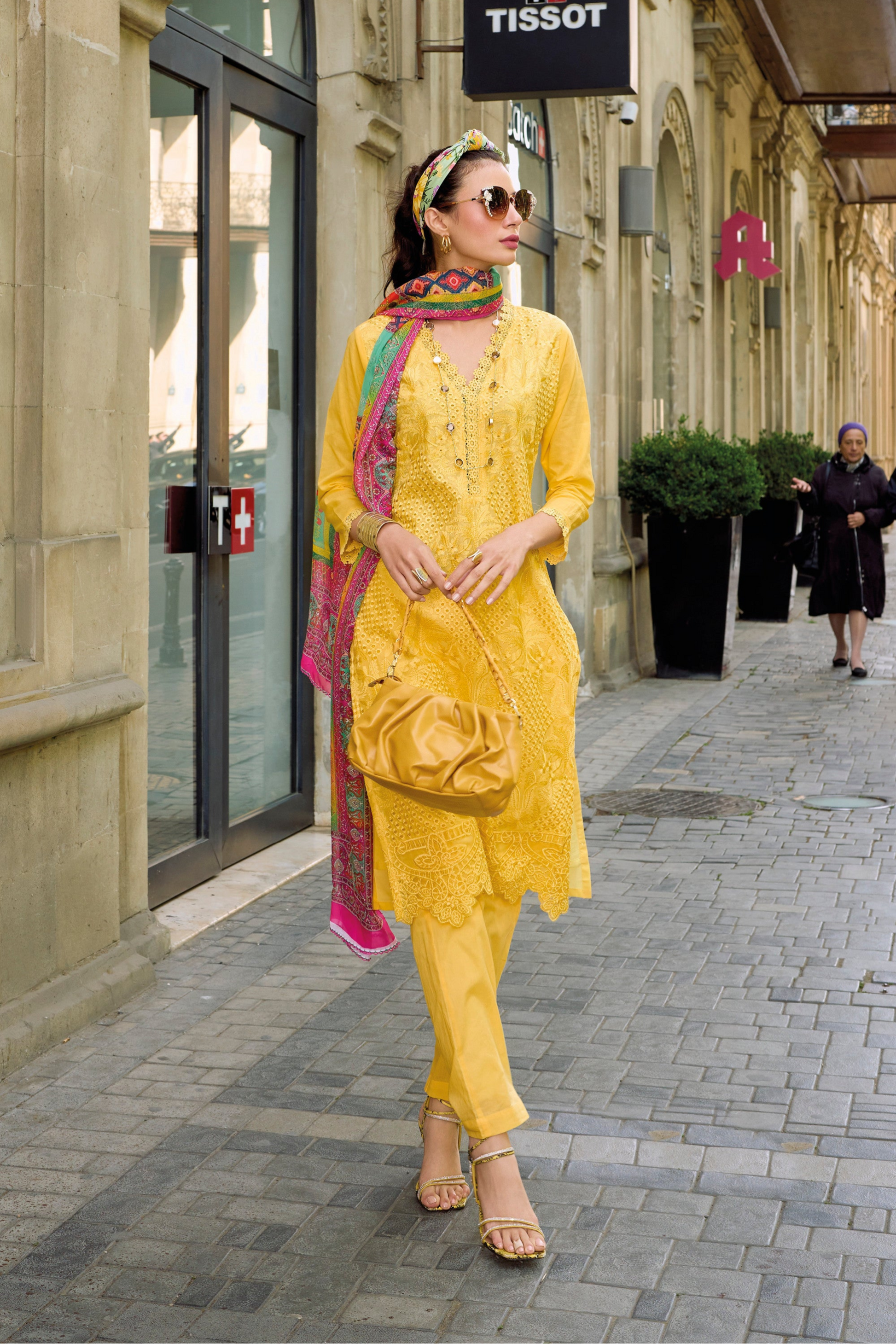 Yellow salwar kameez is bright and happy. Good for haldi or sunny events.
