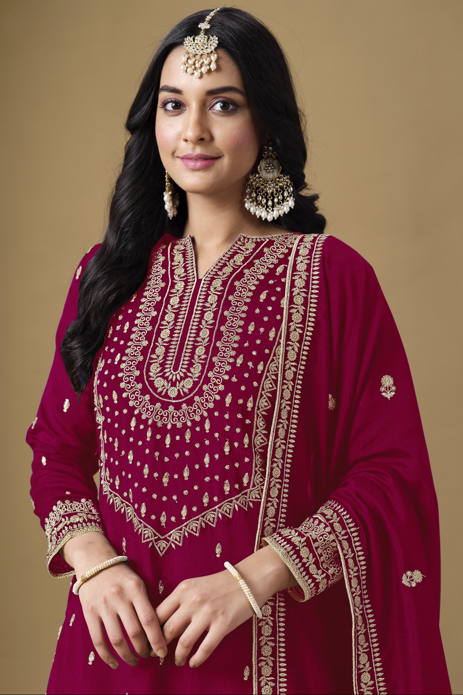 A wine-colored salwar kameez exudes elegance and sophistication
