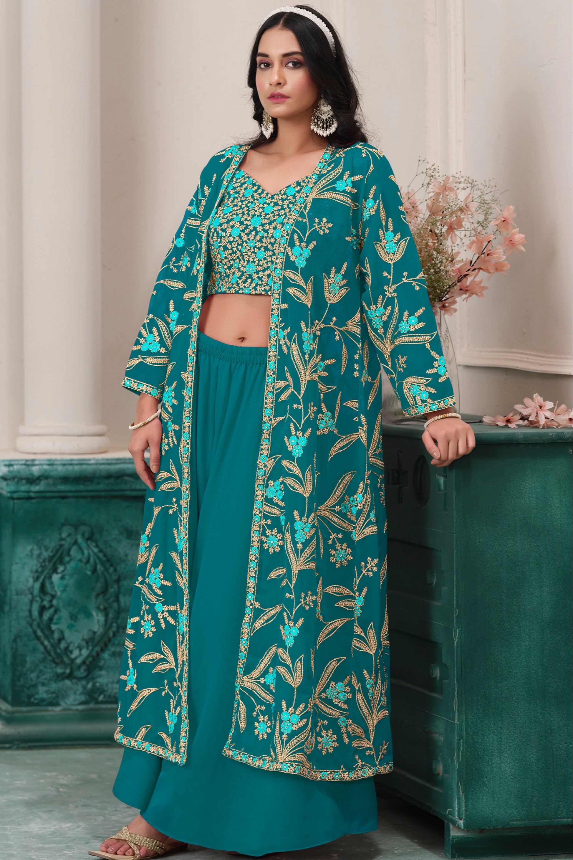 Teal salwar kameez is cool and refreshing. It blends blue and green for a unique look