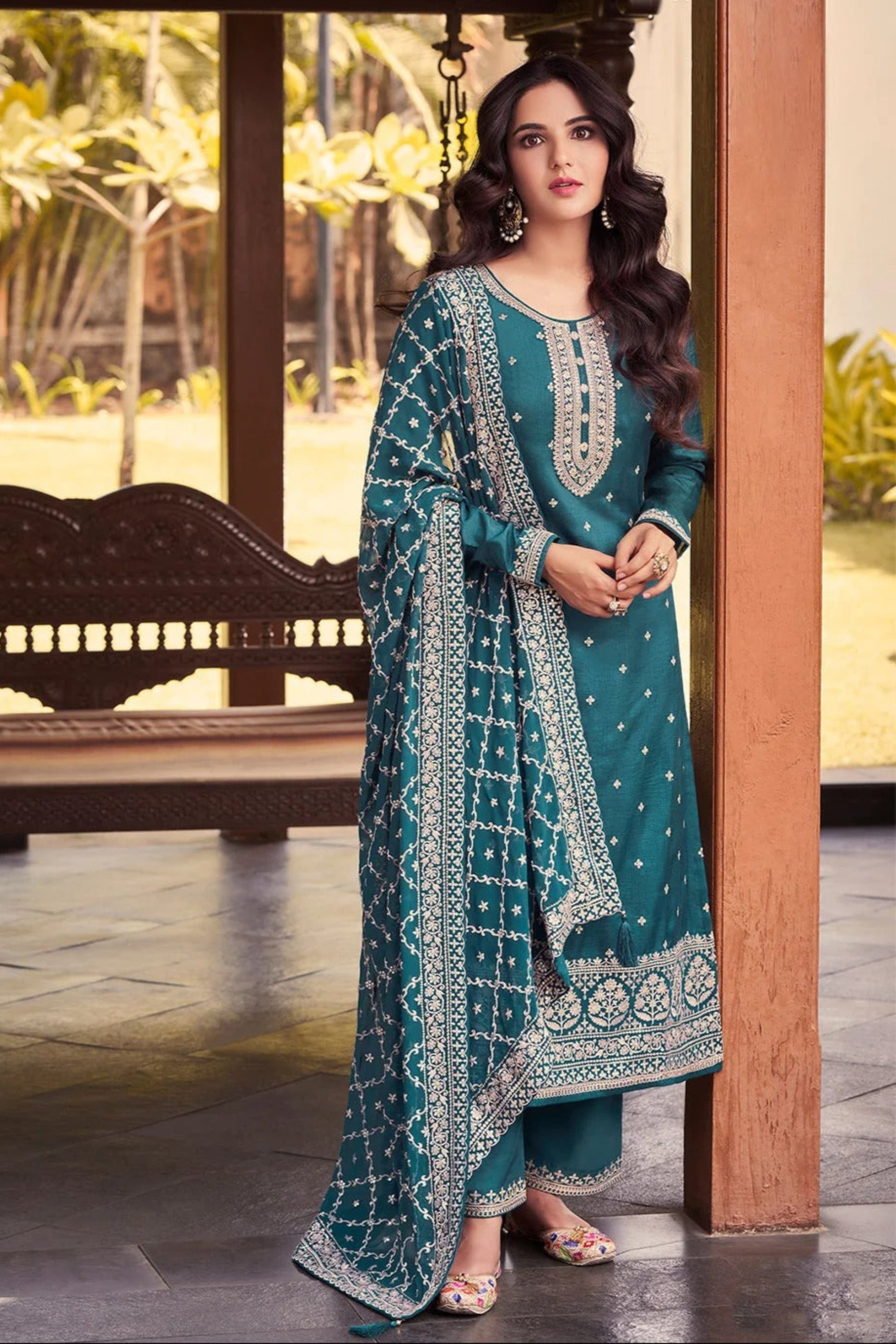 Teal salwar kameez is cool and refreshing. It blends blue and green for a unique look