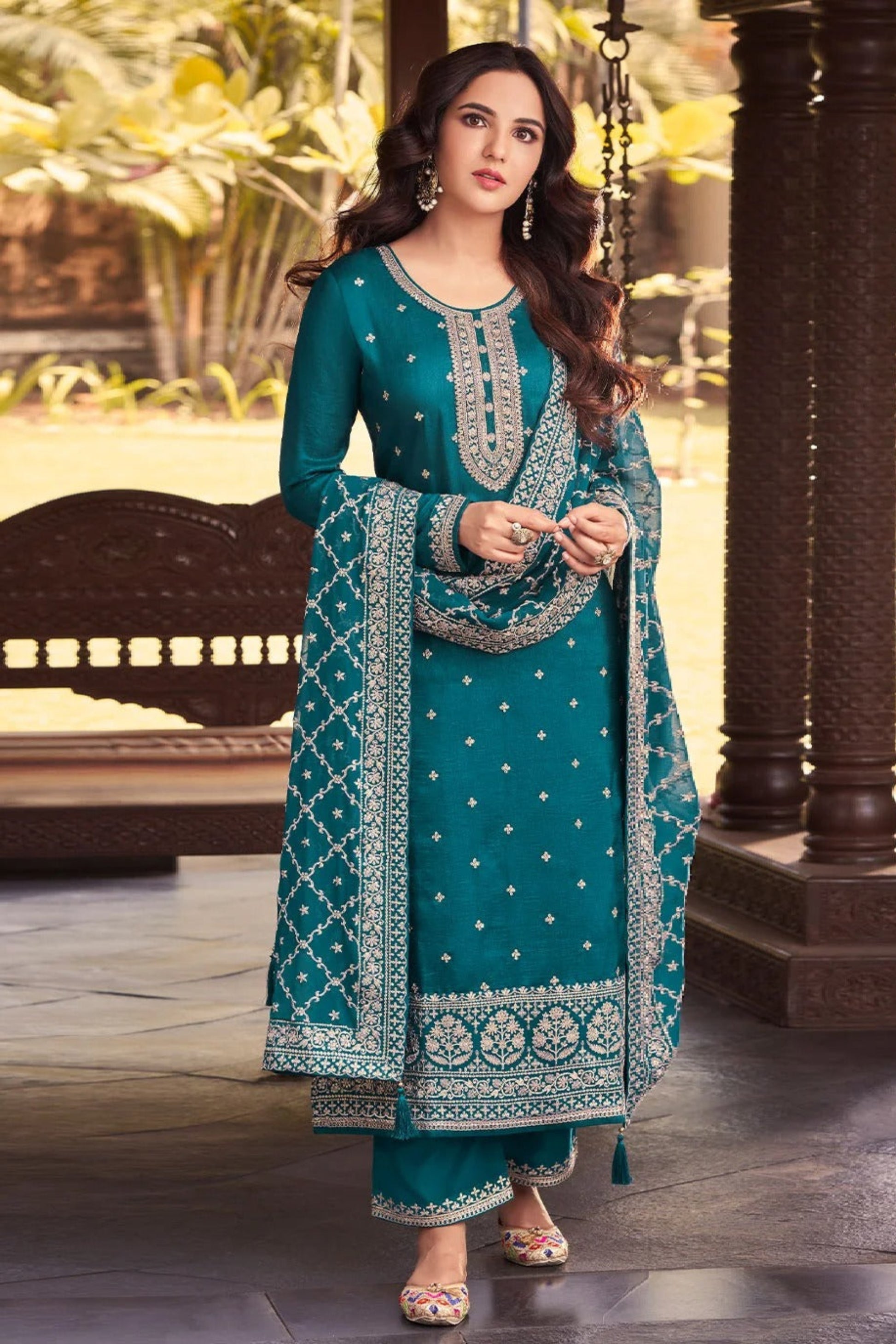 Teal salwar kameez is cool and refreshing. It blends blue and green for a unique look