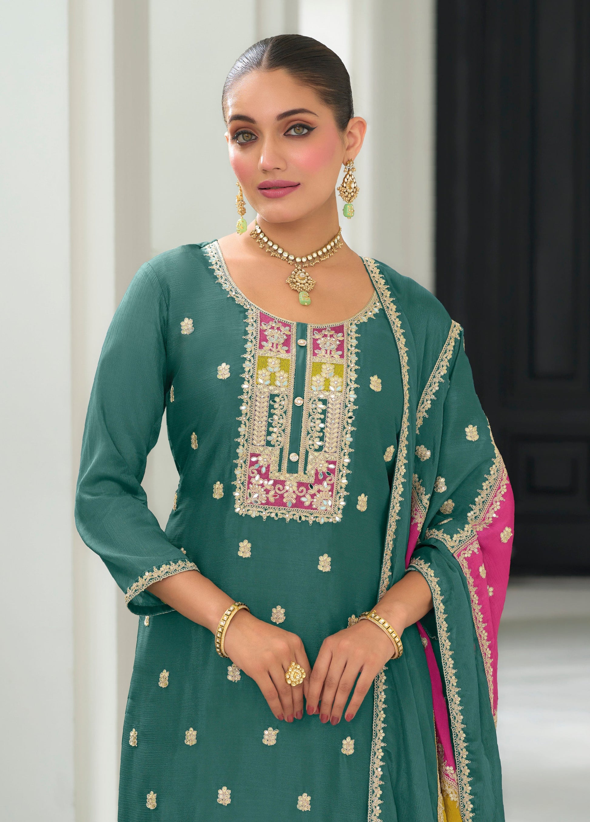 Teal salwar kameez is cool and refreshing. It blends blue and green for a unique look