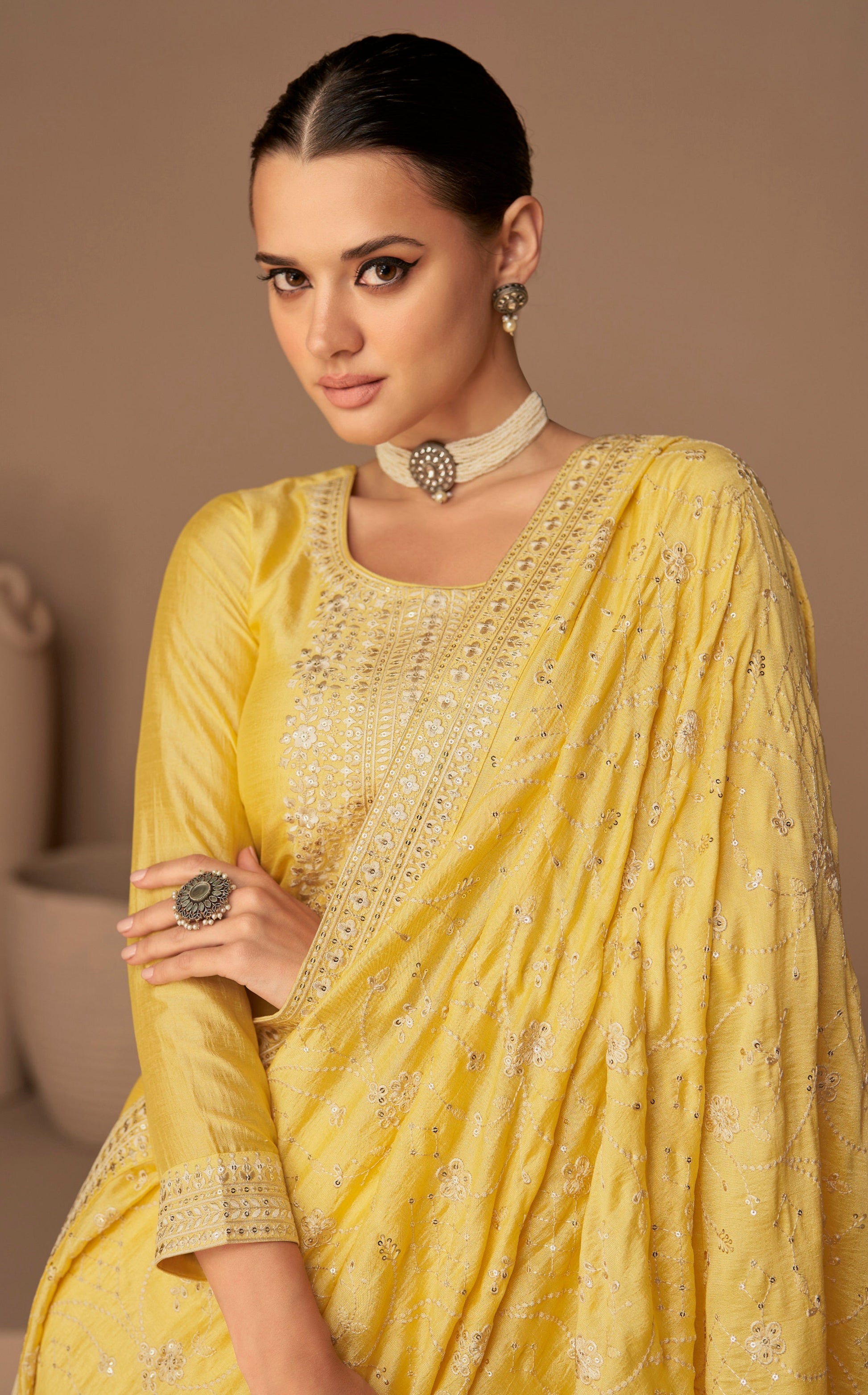 Yellow salwar kameez is bright and happy. Good for haldi or sunny events.
