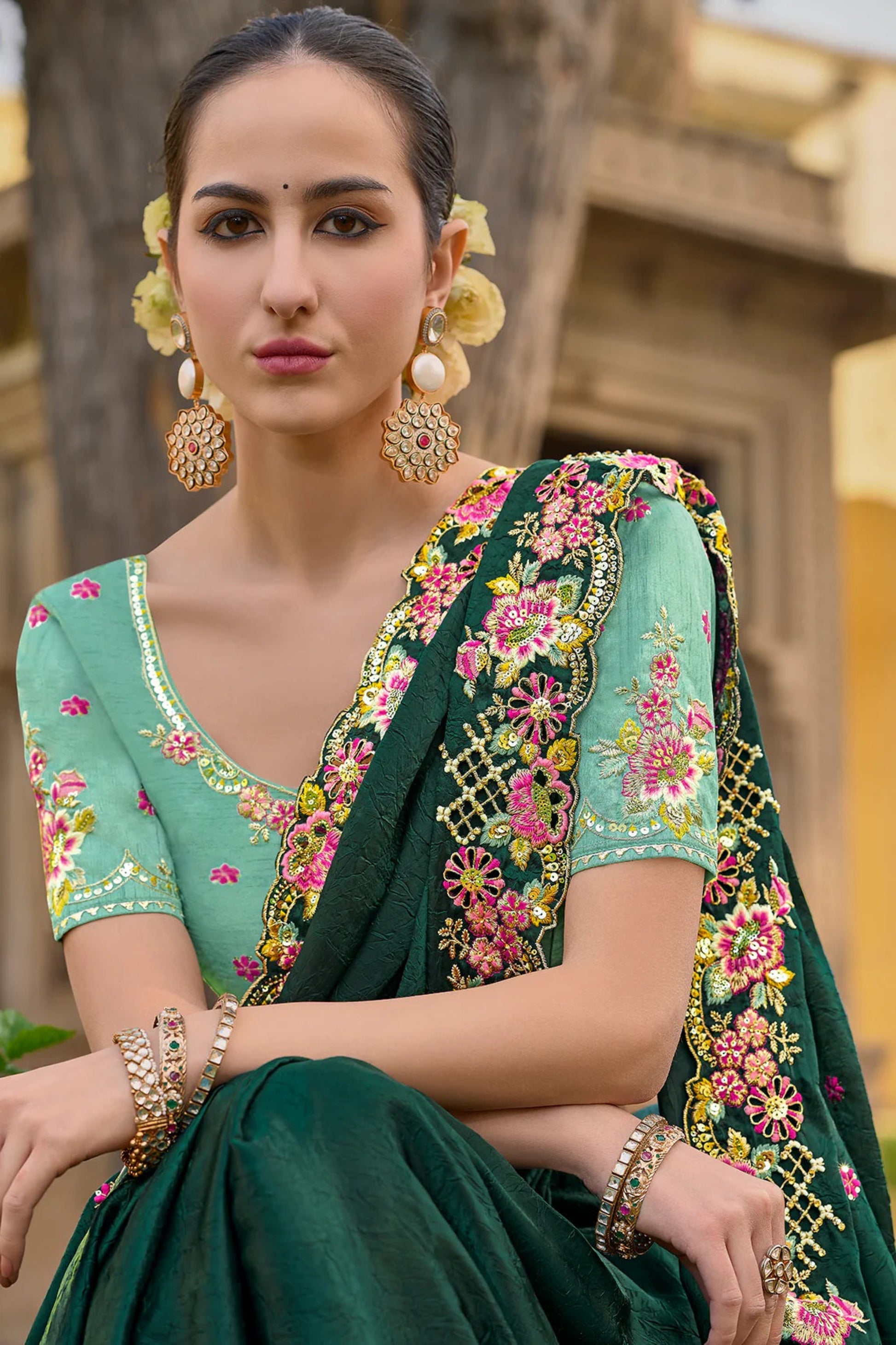 Green Saree symbolizes freshness and festivity – great for Mehndi or family gatherings.
