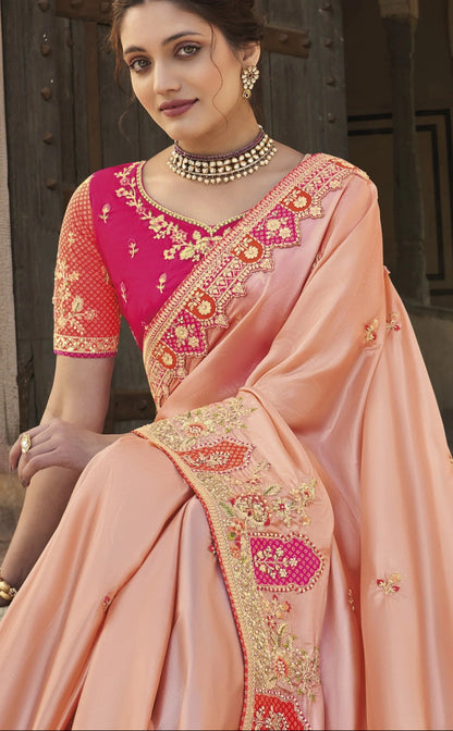 Peach Saree gives a soft and fresh look – perfect for daytime events and breezy celebrations.
