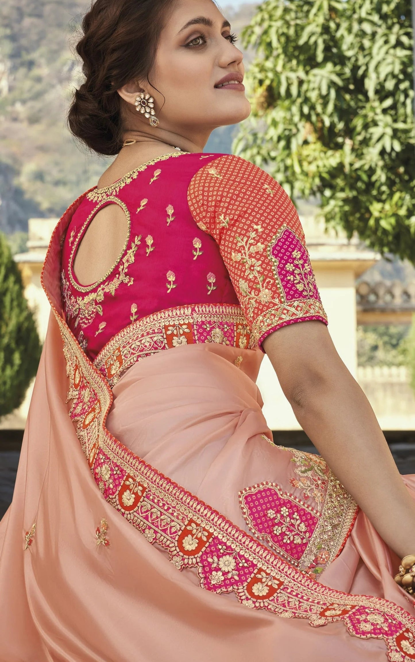 Peach Saree gives a soft and fresh look – perfect for daytime events and breezy celebrations.

