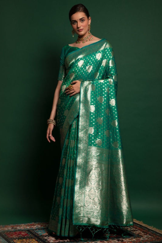 Green Saree symbolizes freshness and festivity – great for Mehndi or family gatherings.
