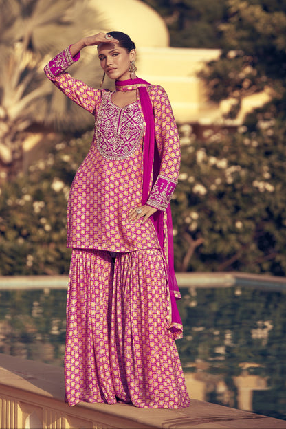 Light pink color sharara suit in Chinon silk fabric with delicate embroidery work, perfect for a graceful and festive ethnic look.
