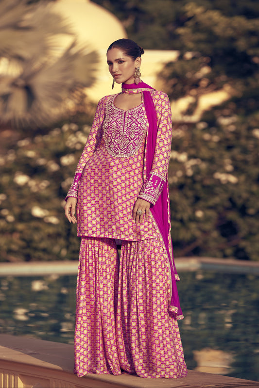 Light pink color sharara suit in Chinon silk fabric with delicate embroidery work, perfect for a graceful and festive ethnic look.
