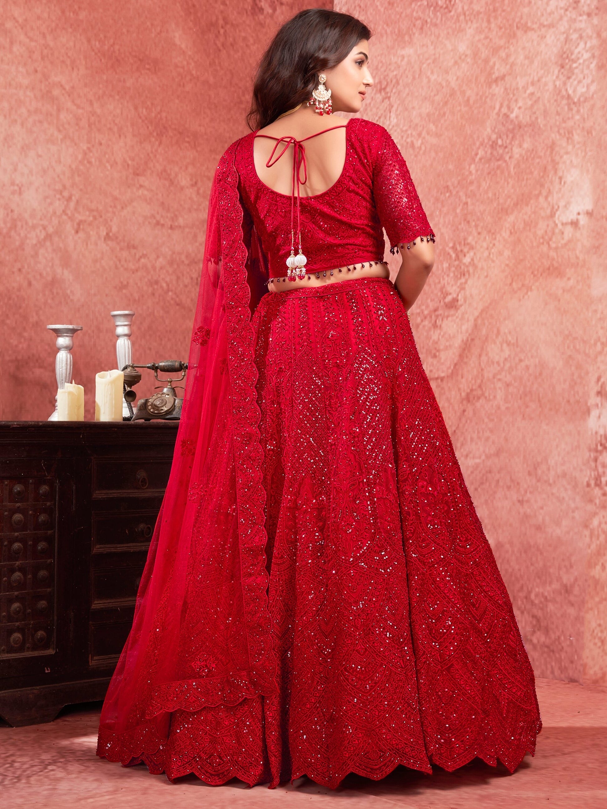 "Runway Red: Statement Bridal Lehenga with Contemporary Flair"
