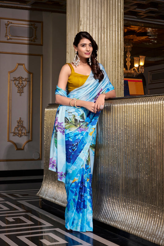 Sky blue satin silk saree with floral prints—perfect for weddings.