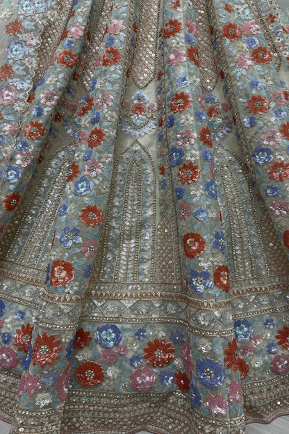 Elegant net lehenga with heavy embroidery for wedding party
