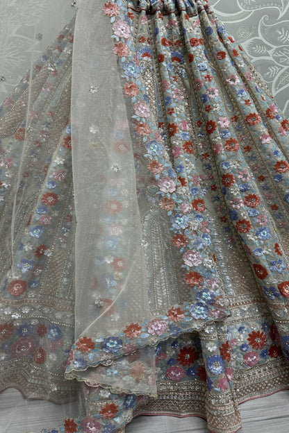 Elegant net lehenga with heavy embroidery for wedding party