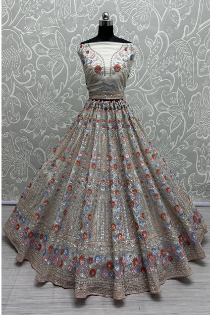 Elegant net lehenga with heavy embroidery for wedding party