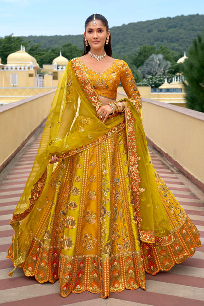 Yellow silk wedding lehenga choli with sequin embroidery and mirror work for Indian bridal ceremonies